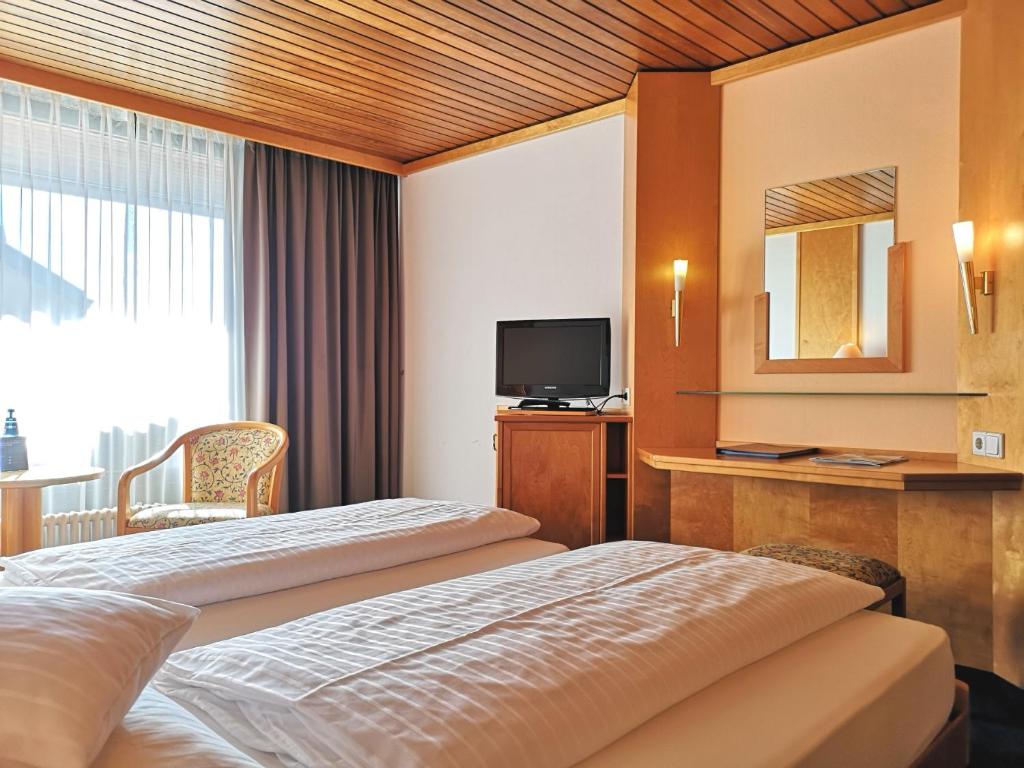 Ein Bett oder Betten in einem Zimmer der Unterkunft Hotel Stadt Breisach