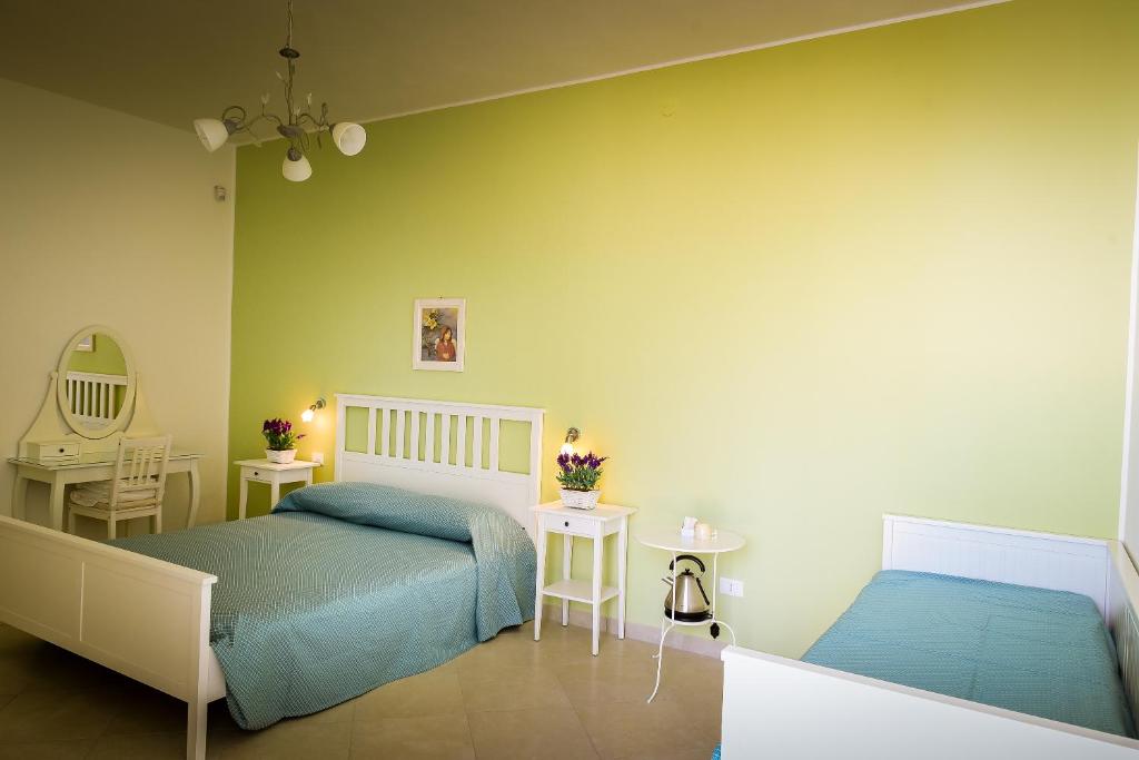Postel nebo postele na pokoji v ubytování B&b Noto beach