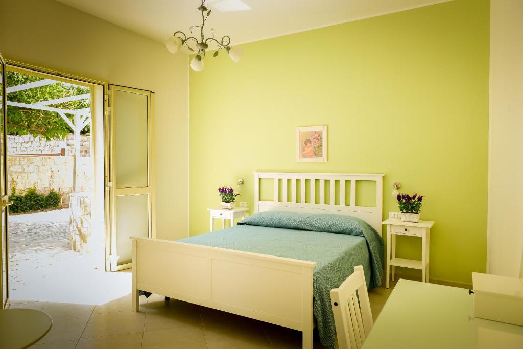 Postel nebo postele na pokoji v ubytování B&b Noto beach