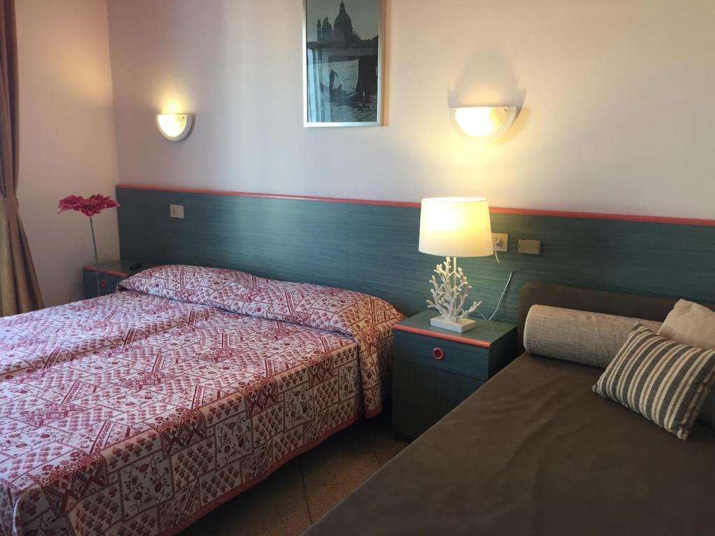 Postel nebo postele na pokoji v ubytování Hotel Storione