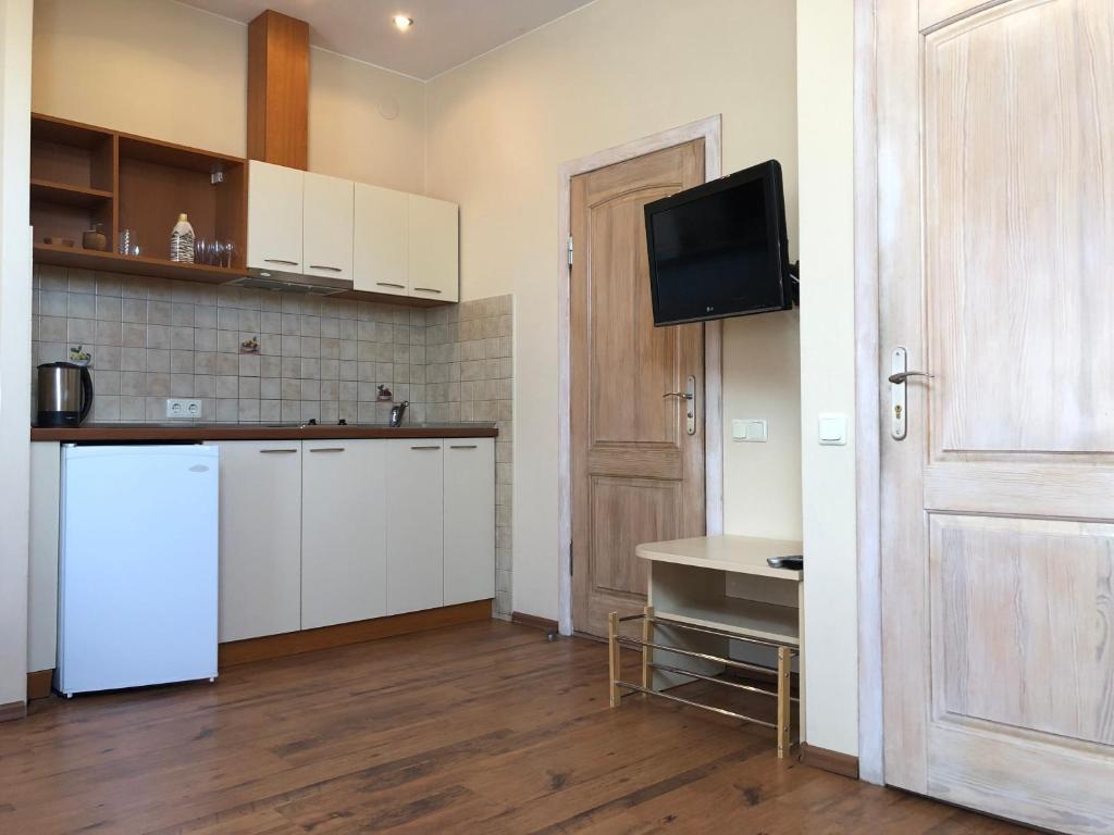 Kuchyň nebo kuchyňský kout v ubytování Apartamentai Viktorija