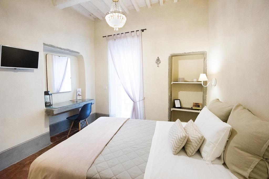 Posteľ alebo postele v izbe v ubytovaní Il Piccolo Cavour Charming House B&B