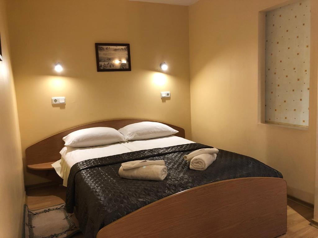 Postel nebo postele na pokoji v ubytování Apartamentai Viktorija