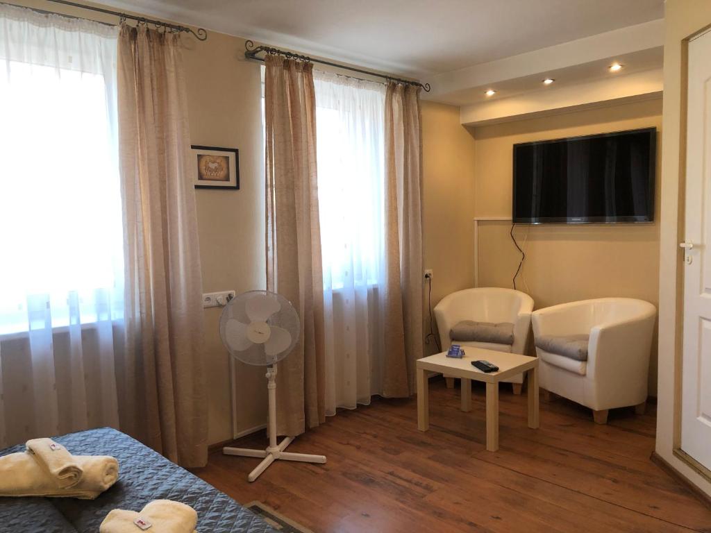 Postel nebo postele na pokoji v ubytování Apartamentai Viktorija