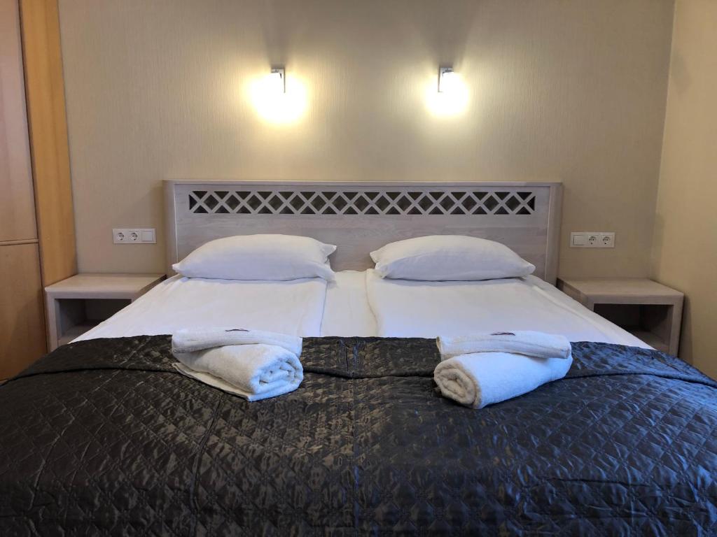 Postel nebo postele na pokoji v ubytování Apartamentai Viktorija