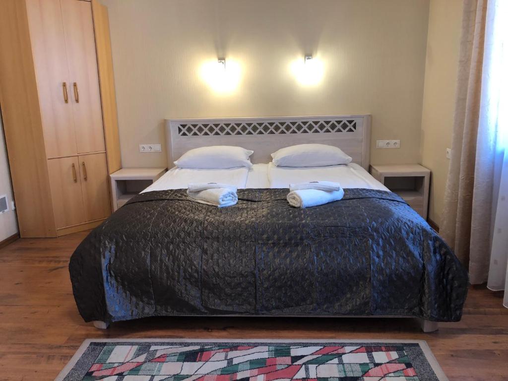 Postel nebo postele na pokoji v ubytování Apartamentai Viktorija