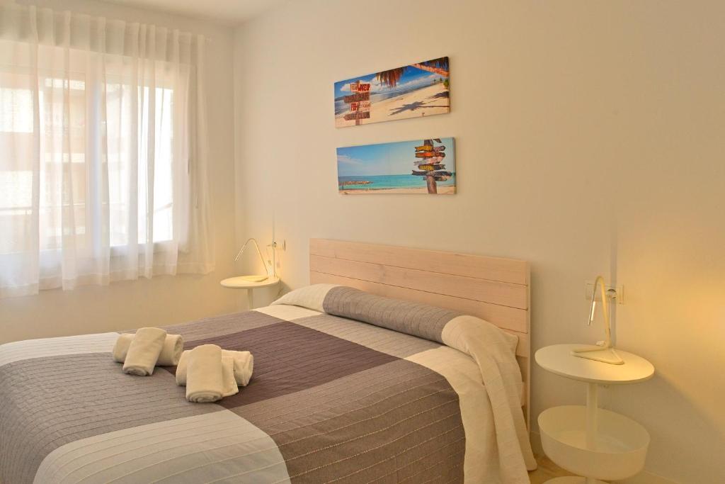 A bed or beds in a room at MyFlats La Palma