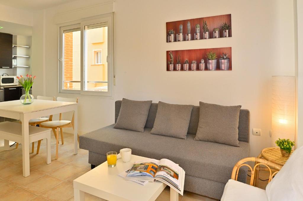 a living room with a couch and a table at MyFlats La Palma in El Campello