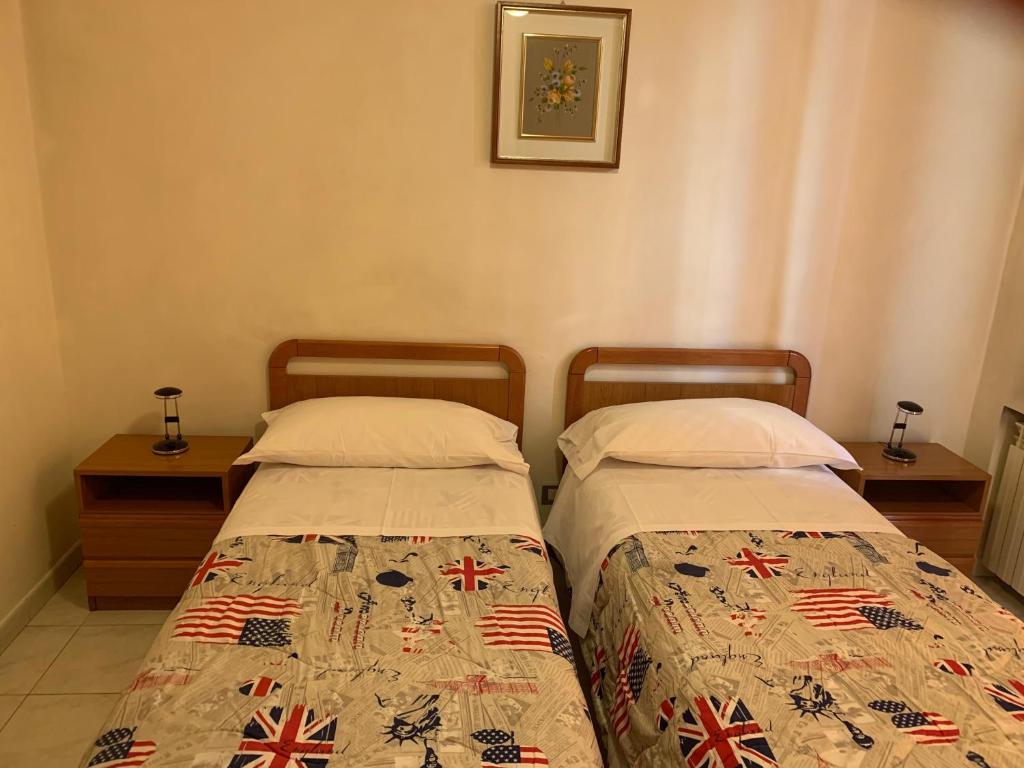 Postel nebo postele na pokoji v ubytování HOTEL ELENA