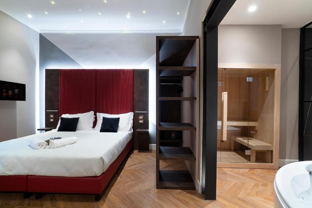 Кровать или кровати в номере Artemide Guest House