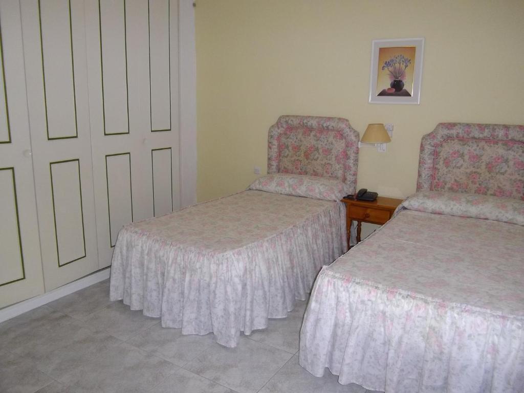 Cama o camas de una habitación en Hotel Sacratif