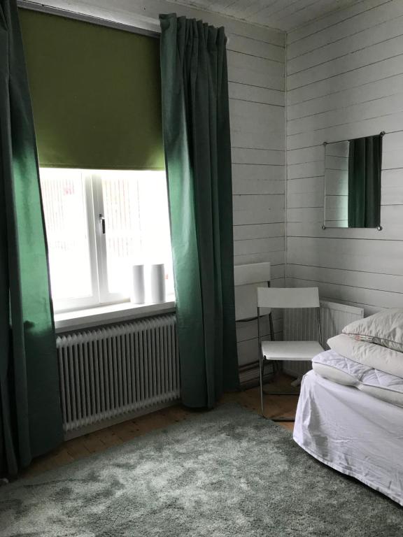 Postel nebo postele na pokoji v ubytování Vintergatans Rum