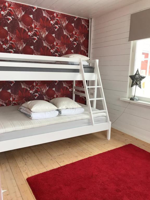 Postel nebo postele na pokoji v ubytování Vintergatans Rum