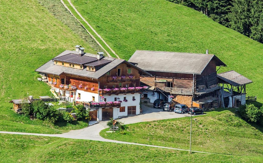 an aerial view of a house in a field at Naschthof in Dobbiaco