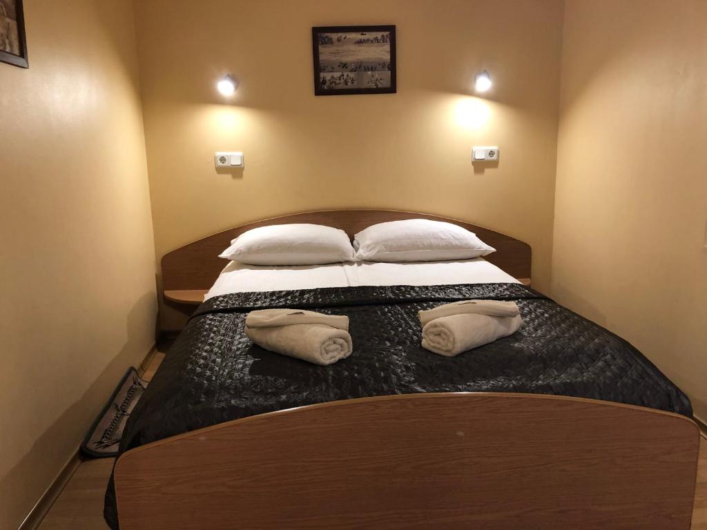 Postel nebo postele na pokoji v ubytování Apartamentai Viktorija