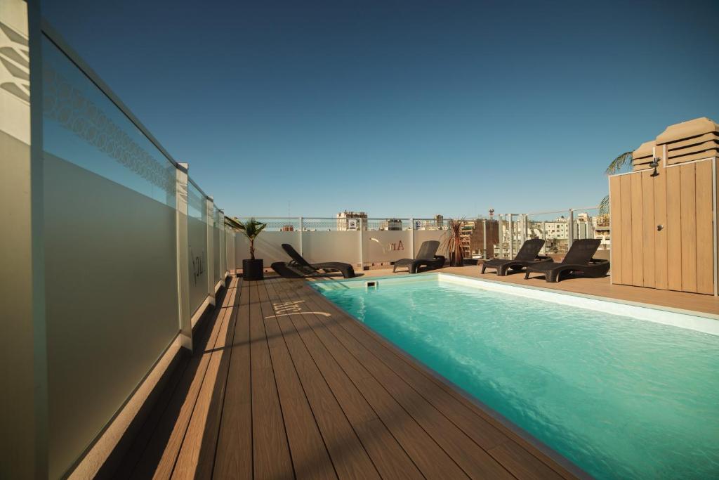 a swimming pool on the roof of a building at ARC Abasto Studios in Buenos Aires