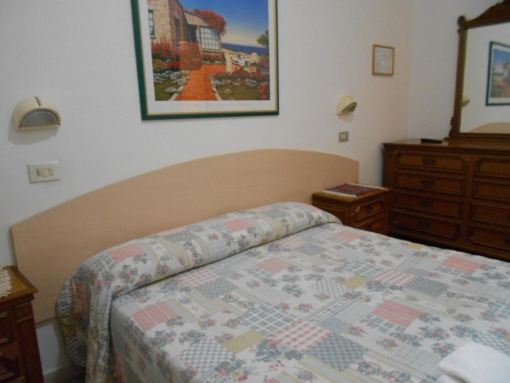 Postel nebo postele na pokoji v ubytování Hotel Laguna Blu