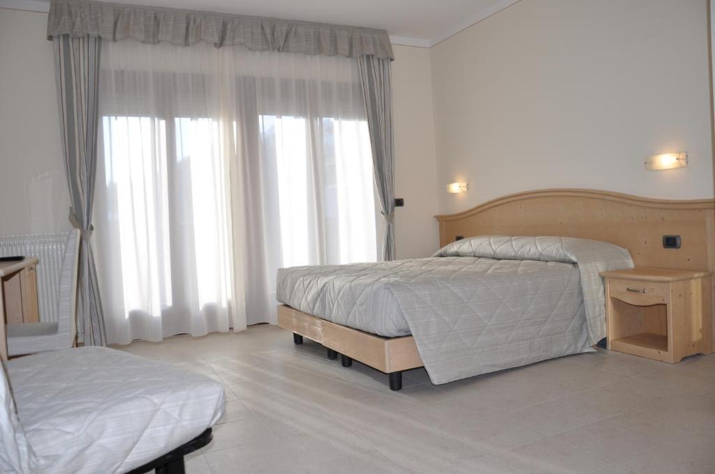 Postel nebo postele na pokoji v ubytování Hotel Select