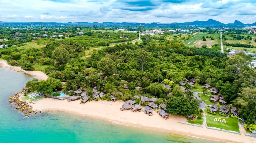 an aerial view of a resort on a beach at The Sunset Village -SHA PLUS CERTIFIED in Na Jomtien