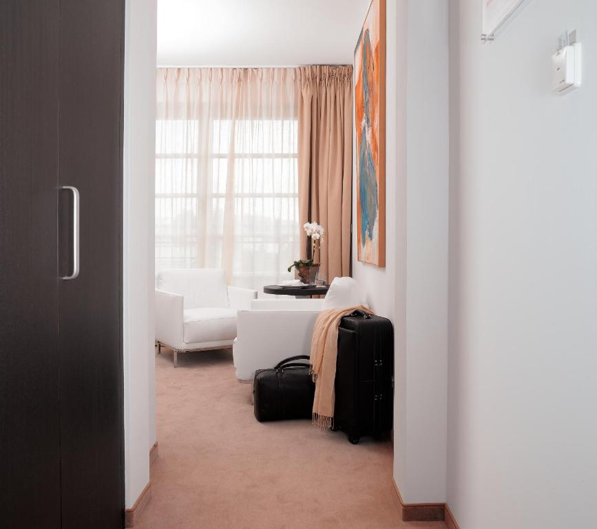 Postel nebo postele na pokoji v ubytování Hotel Alzinn