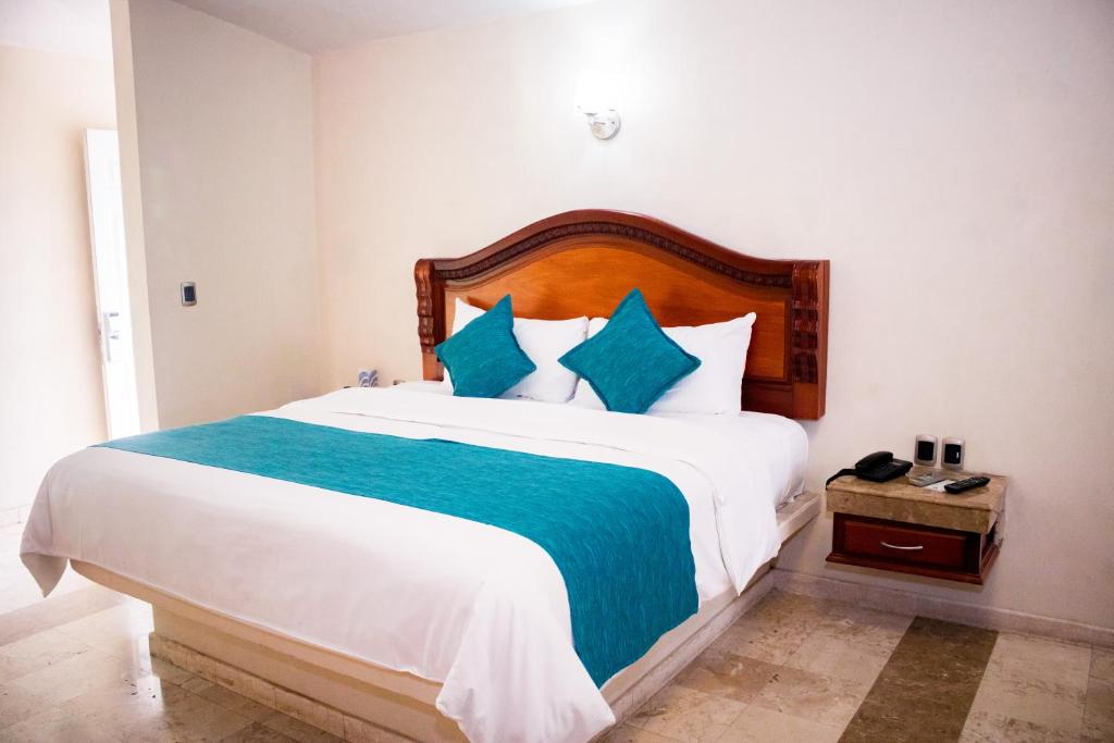 Postel nebo postele na pokoji v ubytování Hotel Aqua Spa & Resort