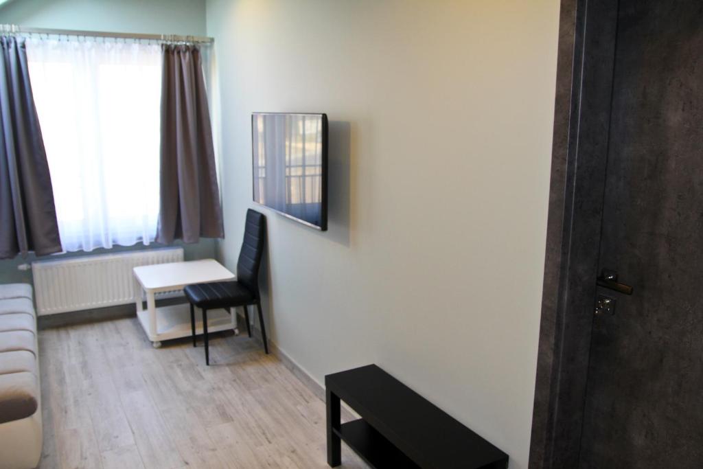 TV a/nebo společenská místnost v ubytování Motel Lunar
