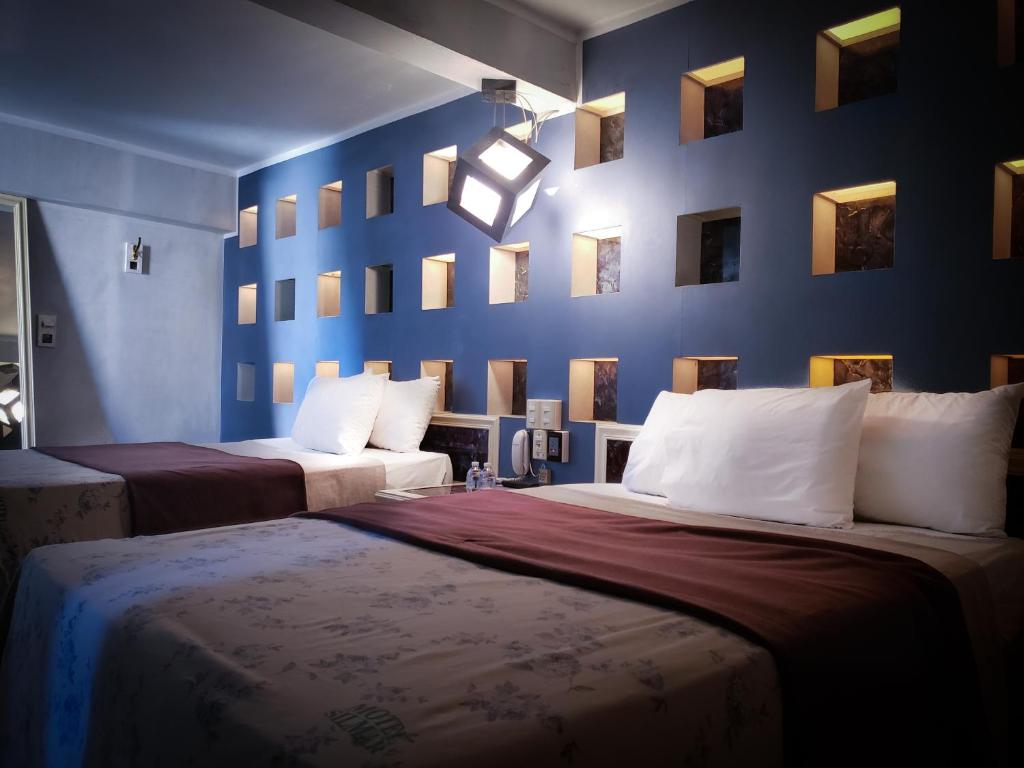 Postel nebo postele na pokoji v ubytování Silmar Hotel/Motel