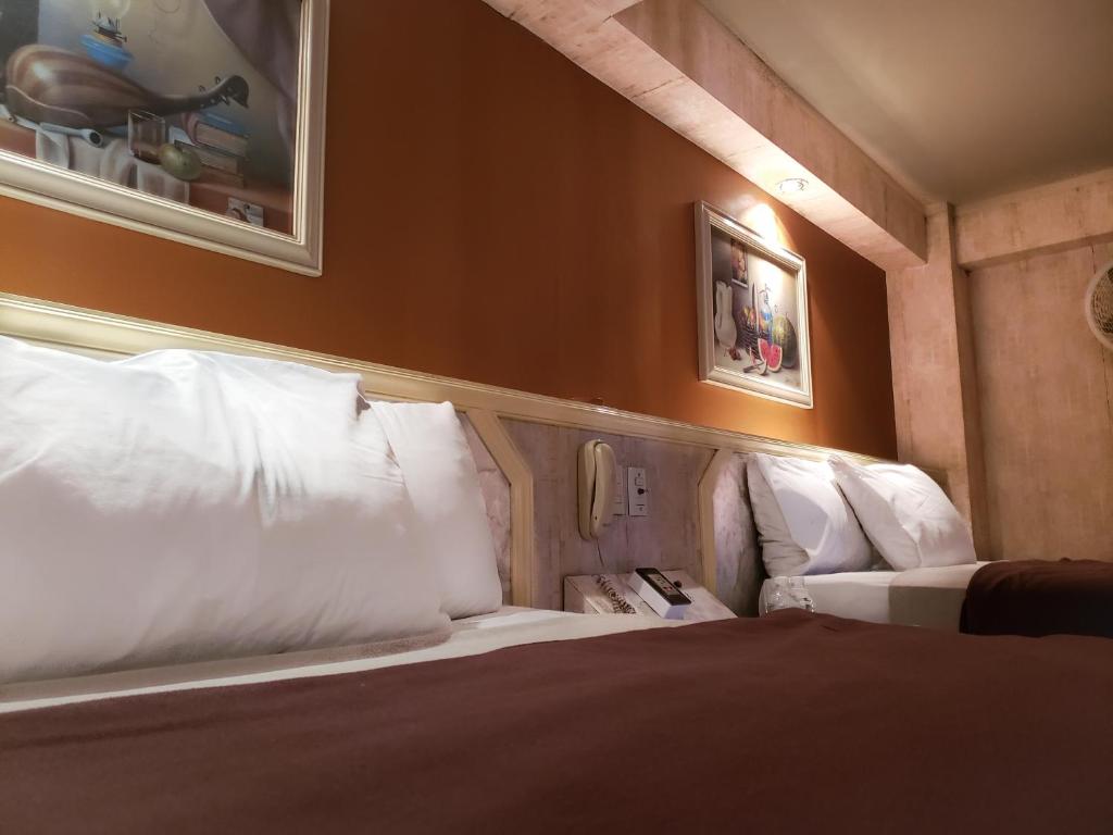Postel nebo postele na pokoji v ubytování Silmar Hotel/Motel
