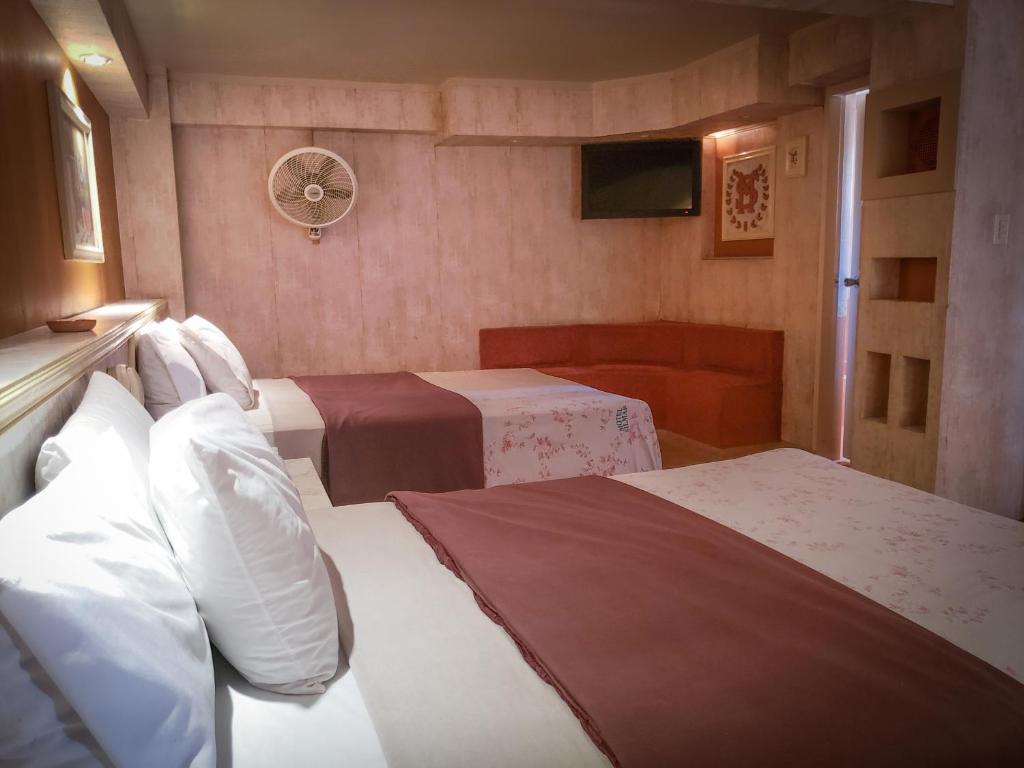 Postel nebo postele na pokoji v ubytování Silmar Hotel/Motel