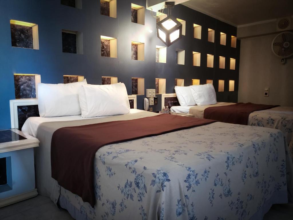Cama o camas de una habitación en Silmar Hotel/Motel