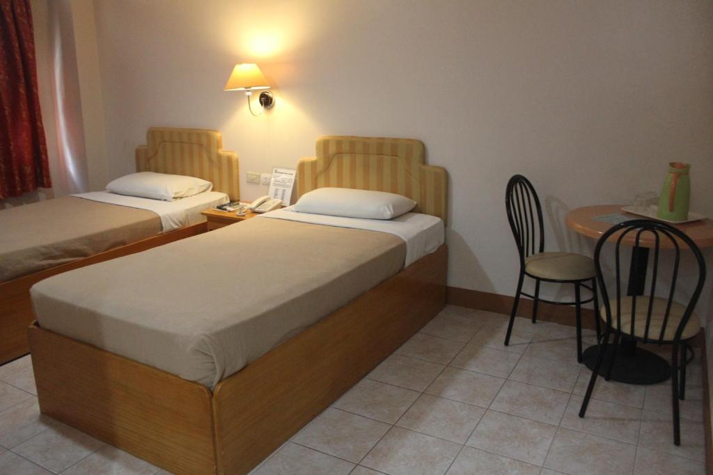 Postel nebo postele na pokoji v ubytování Elegant Circle Inn