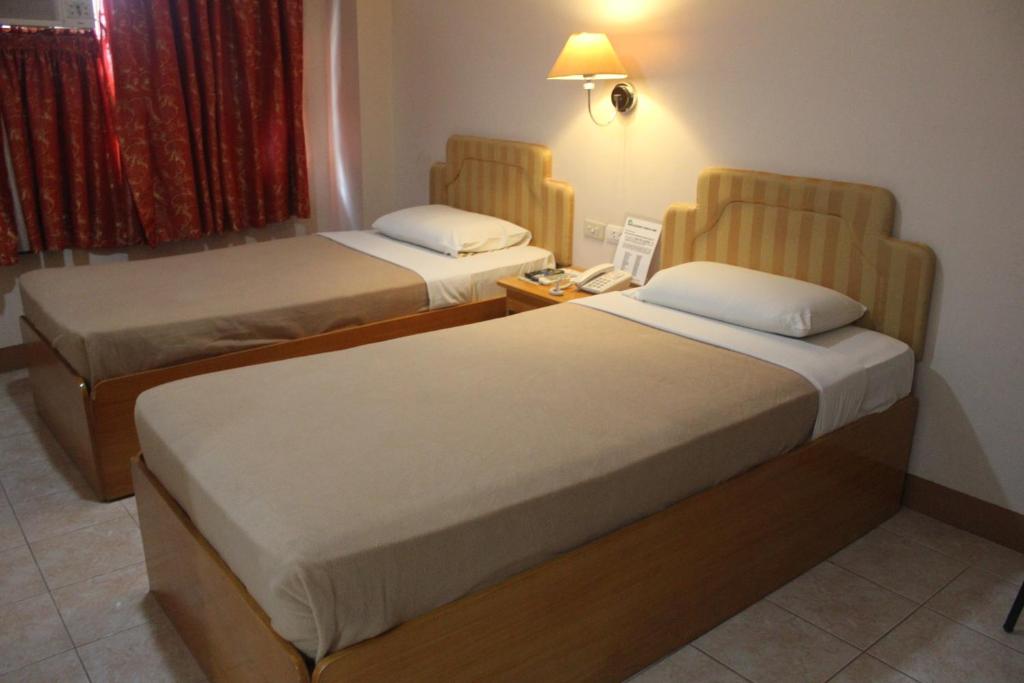 Postel nebo postele na pokoji v ubytování Elegant Circle Inn