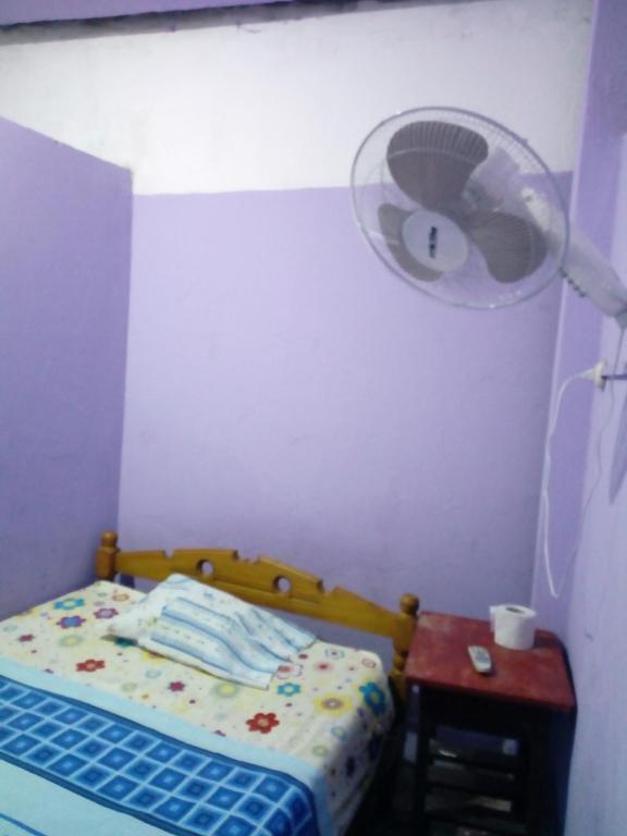 Postel nebo postele na pokoji v ubytování Hospedaje Independencia Pucallpa