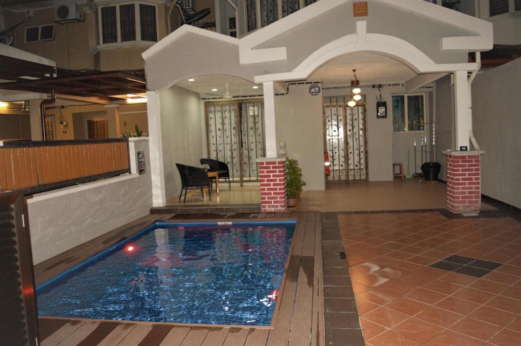 a swimming pool in the middle of a building at Gallery@7Homestay in Shah Alam