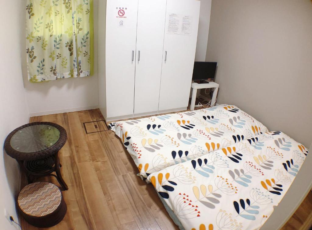 Postel nebo postele na pokoji v ubytování Osaka Tsuruhashitei Hotel Asahi group 大阪鶴橋亭ホテル