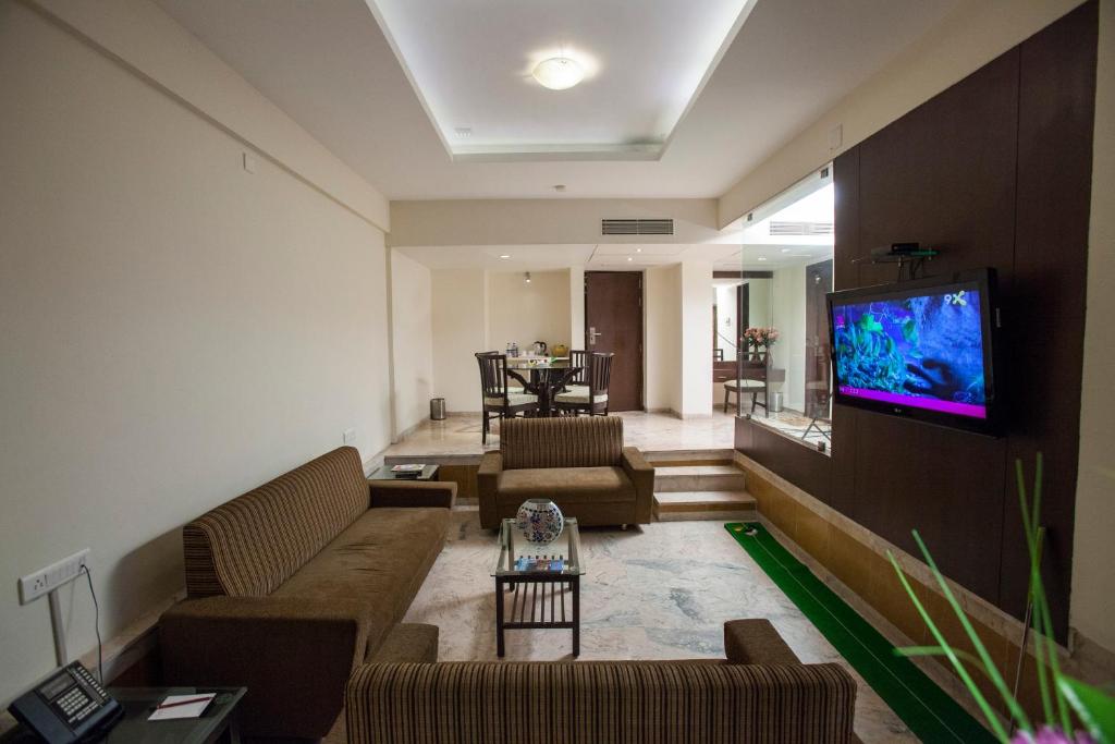 TV a/nebo společenská místnost v ubytování The Oasis