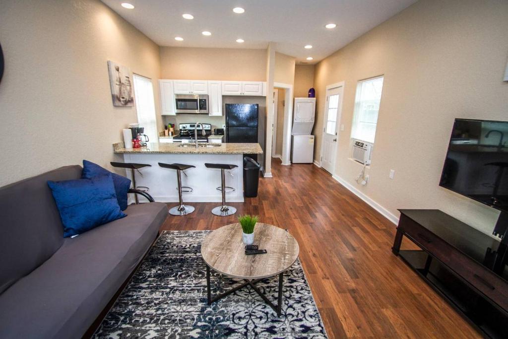 a living room with a couch and a table at Douglas Way Remodeled House Near Downtown 1BA/1BA in San Antonio