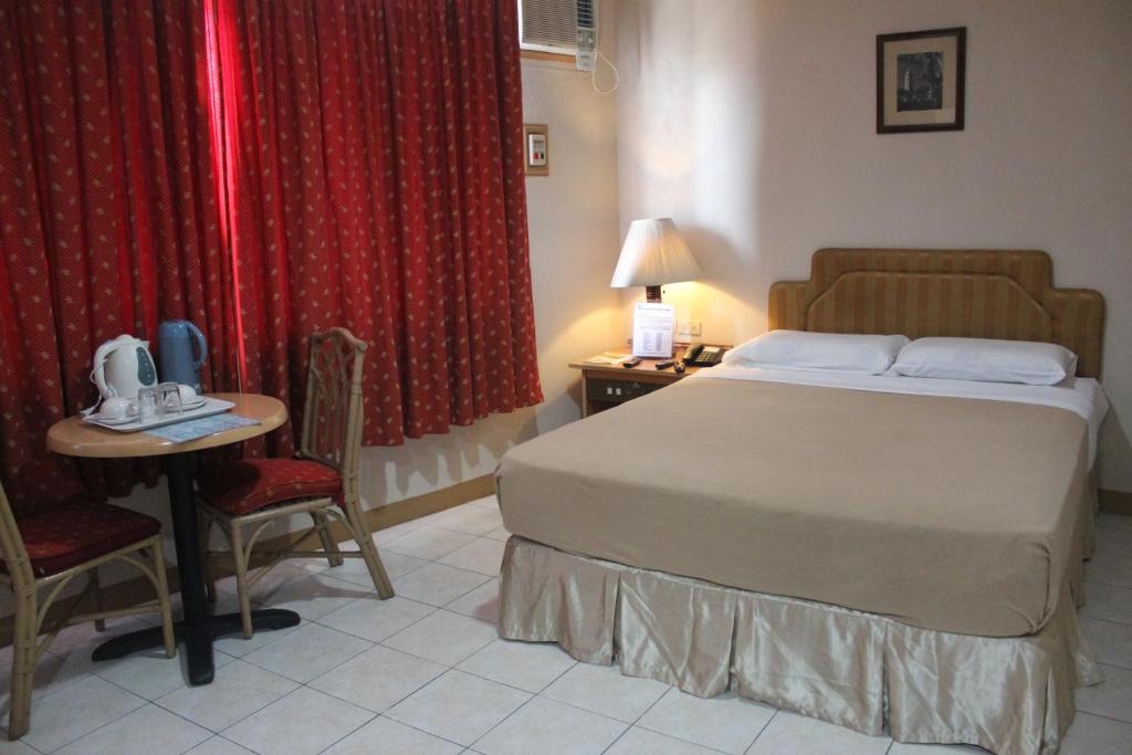 Postel nebo postele na pokoji v ubytování Elegant Circle Inn