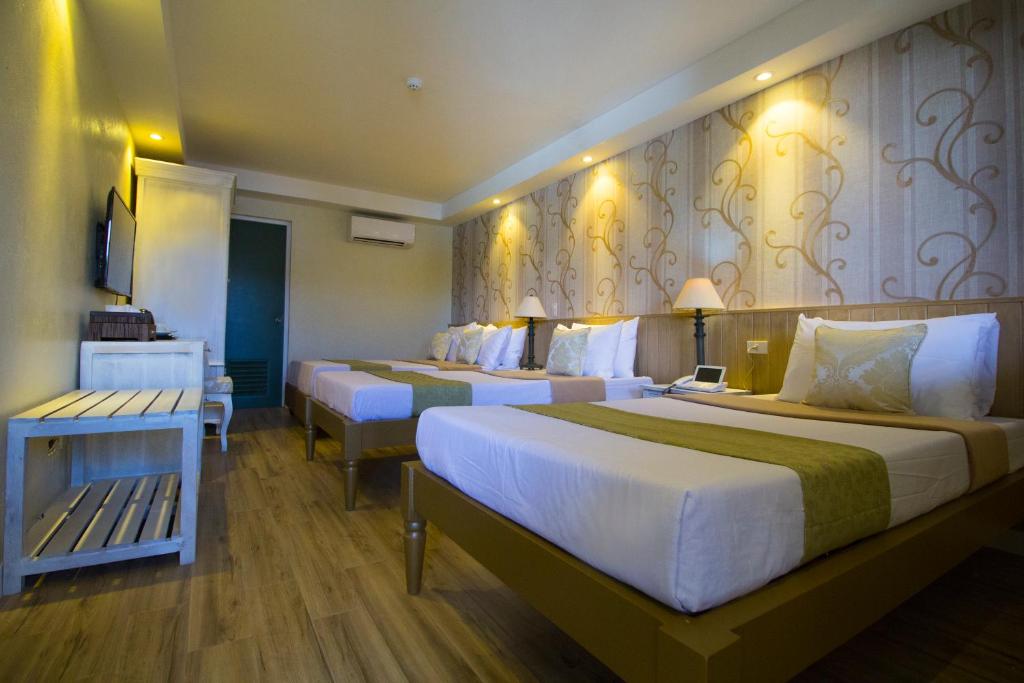 Postel nebo postele na pokoji v ubytování Sola Hotel