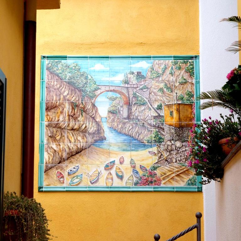 a mural on the side of a building at Il Mulino in Furore