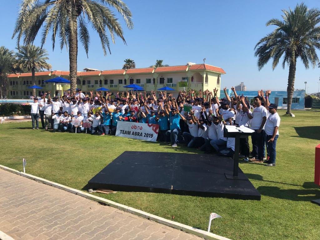 a group of people posing for a picture on a stage at Flamingo Beach Hotel in Umm Al Quwain