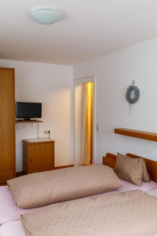 Postel nebo postele na pokoji v ubytování Haus Theresia