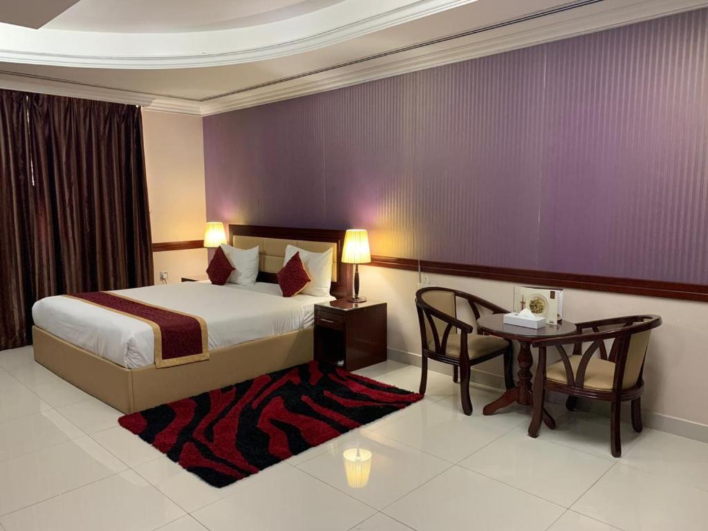 เตียงในห้องที่ Hala Inn Hotel Apartments - BAITHANS