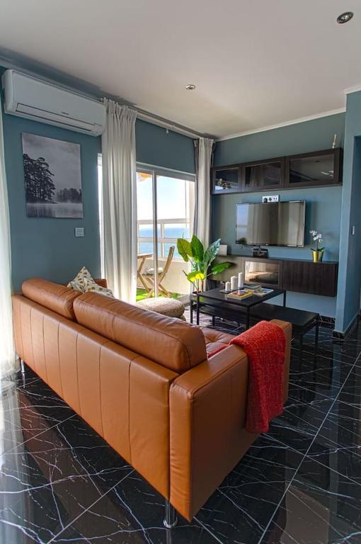 A kitchen or kitchenette at Panoramic Seaview Puerto Marina
