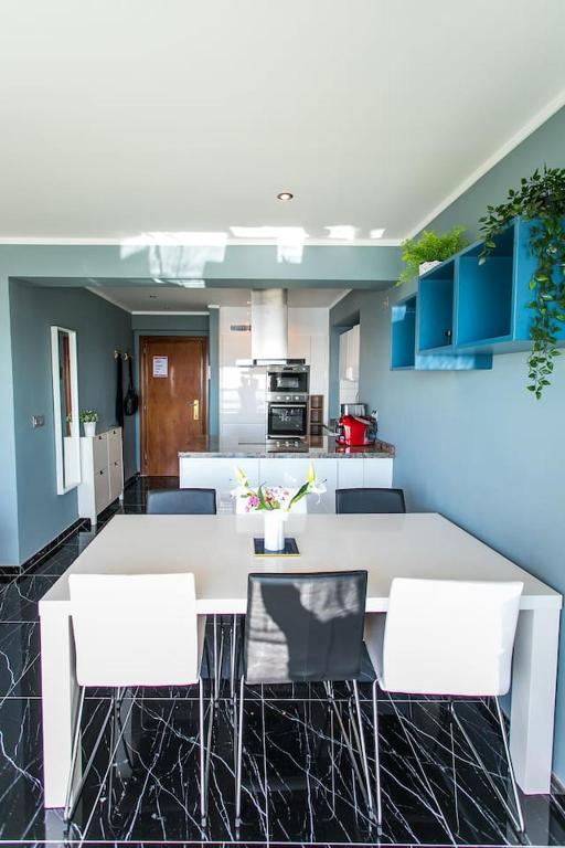 A kitchen or kitchenette at Panoramic Seaview Puerto Marina