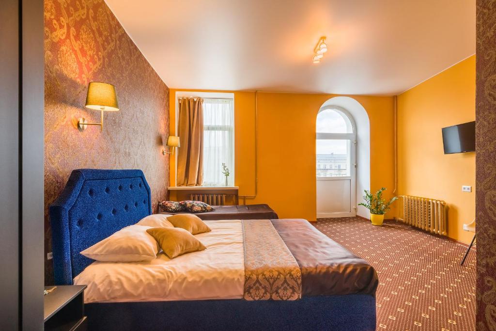 Giường trong phòng chung tại Orange Hotel Chistye Prudy