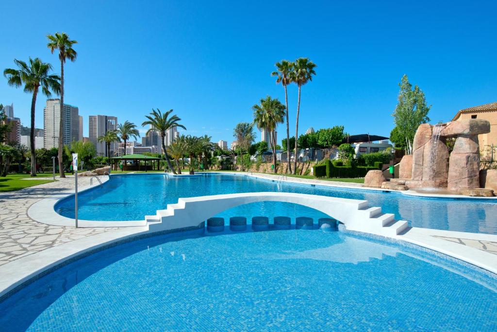 a large swimming pool with blue water at Camping Villasol in Benidorm