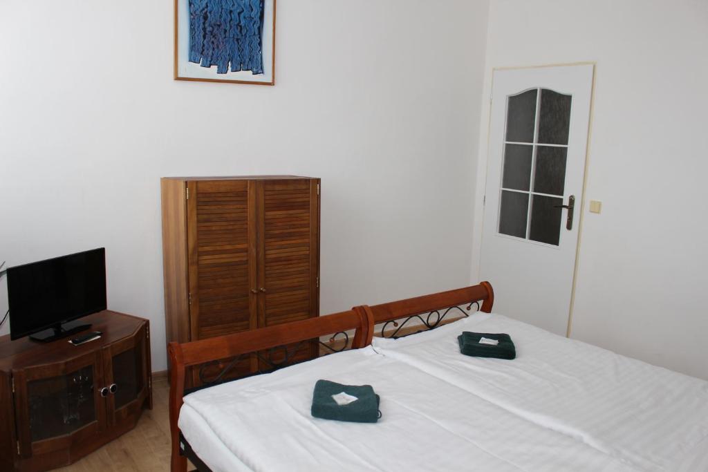 Postel nebo postele na pokoji v ubytování Hotel Černý kůň