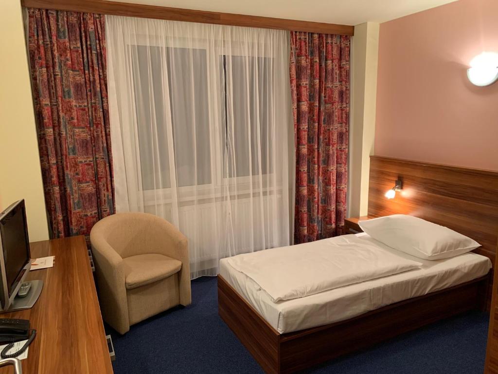 Łóżko lub łóżka w pokoju w obiekcie Wellness & Spa Apartments Lipno - Frymburk