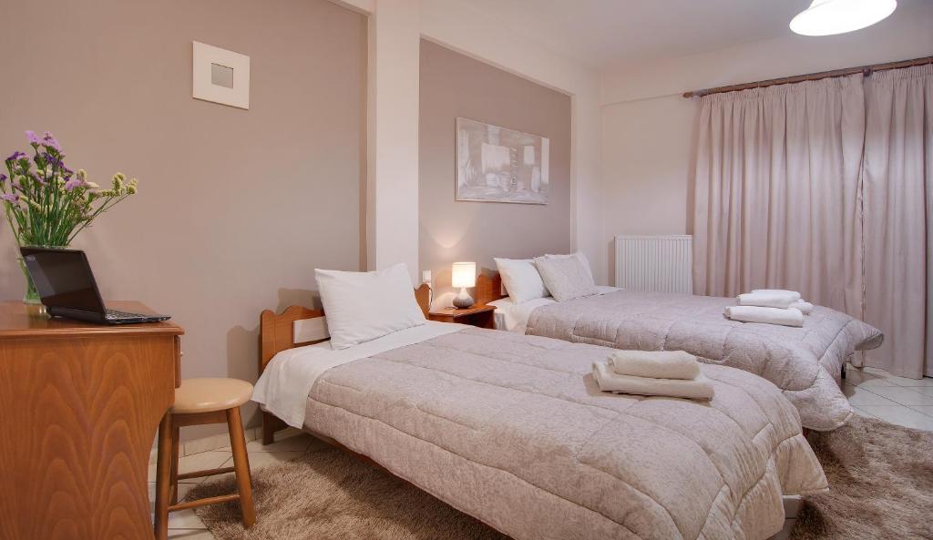 Postel nebo postele na pokoji v ubytování Tsironis Guesthouse